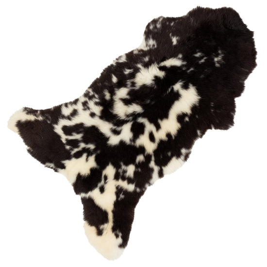 Short Wool Cushy Black and White Spots Sheepskin Rug